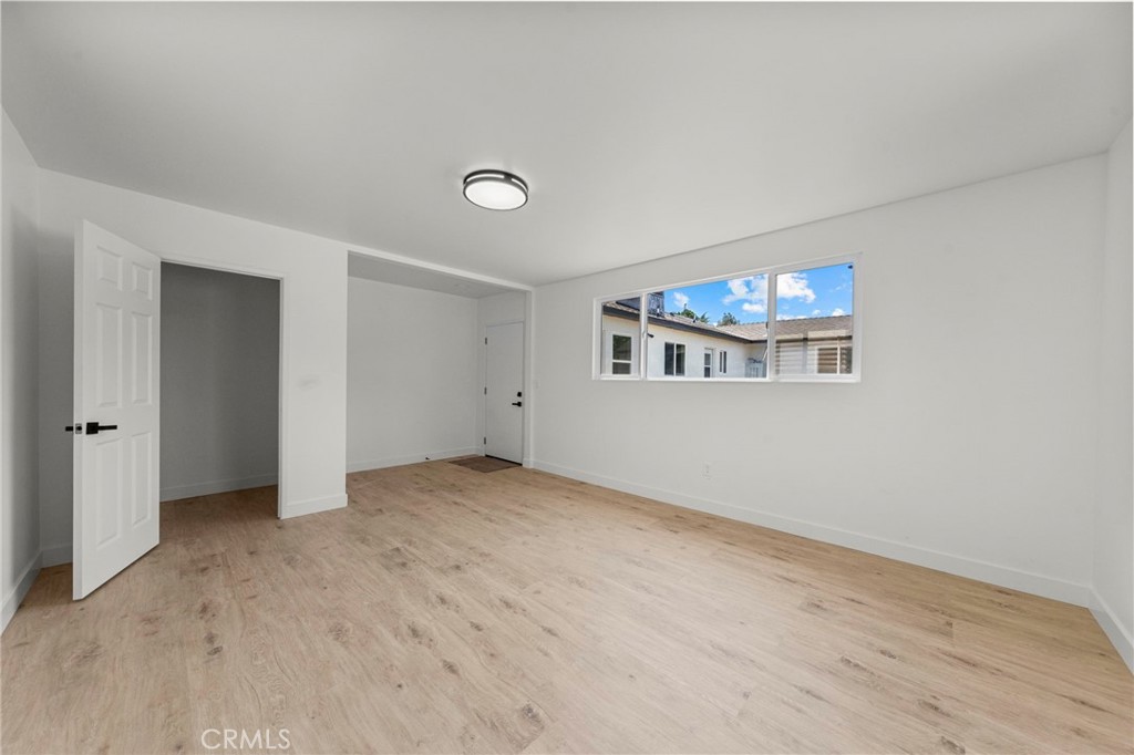 4881 Arlington Avenue Riverside, CA 92504 - Photo 30 of 37 an empty room with windows and fireplace