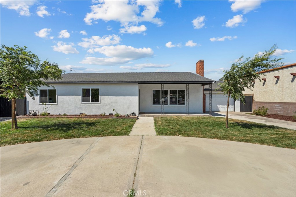 4881 Arlington Avenue Riverside, CA 92504 - Photo 3 of 37 a view of a house with a yard and large tree