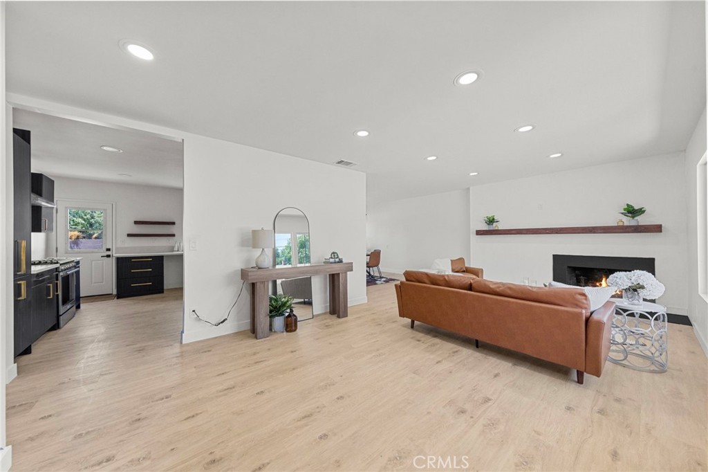4881 Arlington Avenue Riverside, CA 92504 - Photo 6 of 37 a living room with furniture and kitchen view