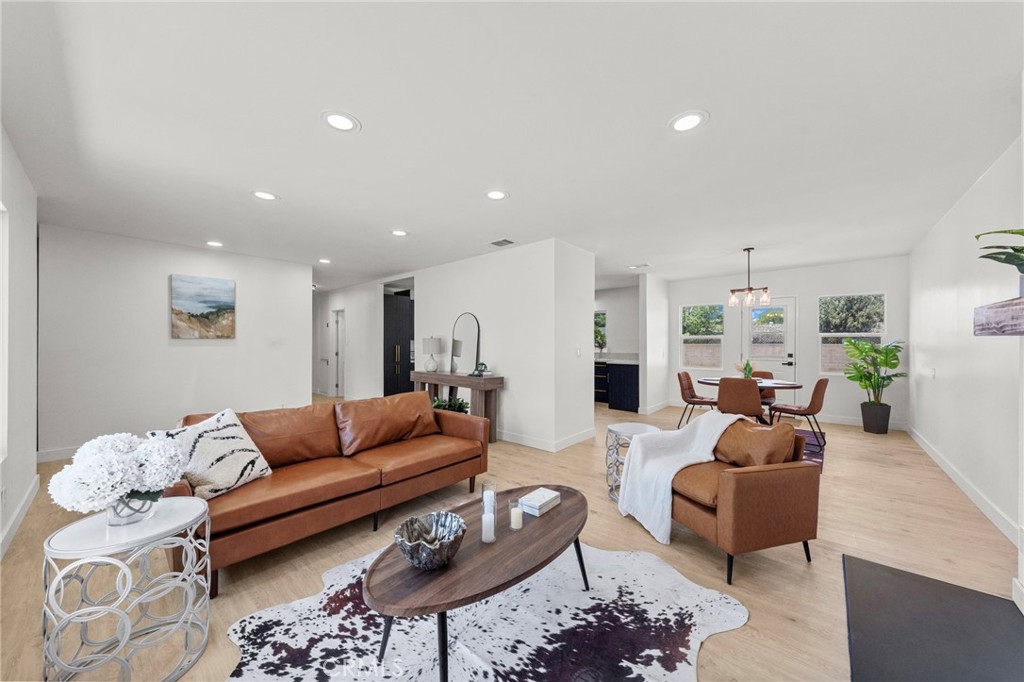 4881 Arlington Avenue Riverside, CA 92504 - Photo 8 of 37 a living room with furniture and wooden floor