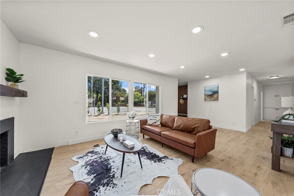 4881 Arlington Avenue Riverside, CA 92504 - Photo 9 of 37 a living room with furniture and a large window