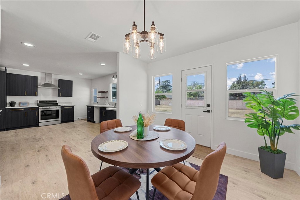 4881 Arlington Avenue Riverside, CA 92504 - Photo 10 of 37 a view of a dining room with furniture and a potted plant
