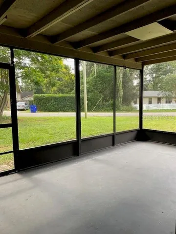 a view of an empty room with a large window