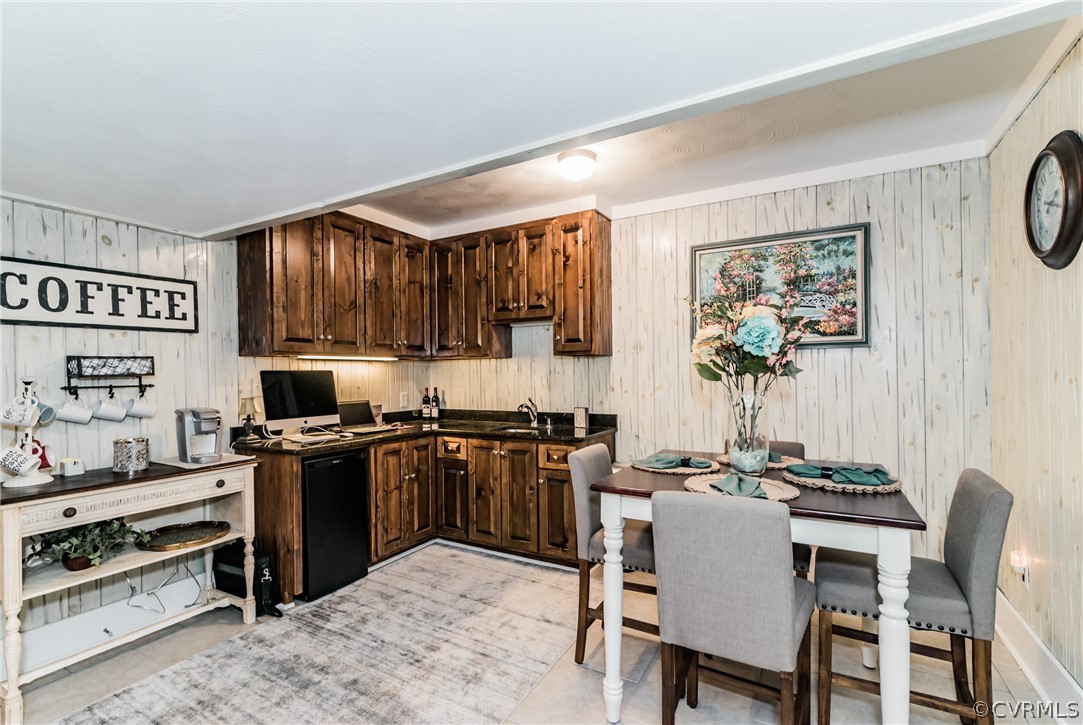 4401 Dunraven Road Chesterfield, VA 23236 - Photo 16 of 35 a kitchen with stainless steel appliances granite countertop a stove top oven a sink a dining table and chairs with wooden floor