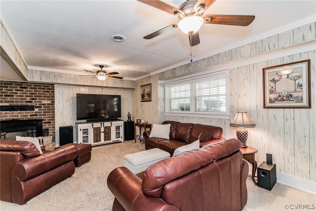 4401 Dunraven Road Chesterfield, VA 23236 - Photo 19 of 35 a living room with furniture and a flat screen tv