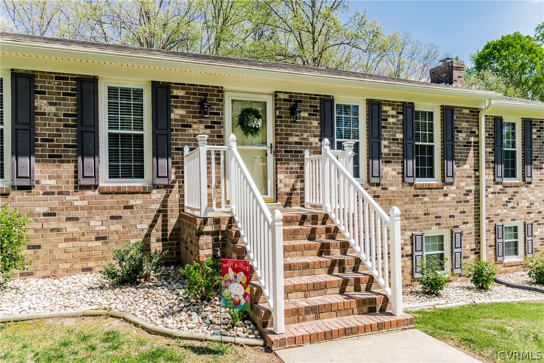 4401 Dunraven Road Chesterfield, VA 23236 - Photo 2 of 35 front view of a house with a porch
