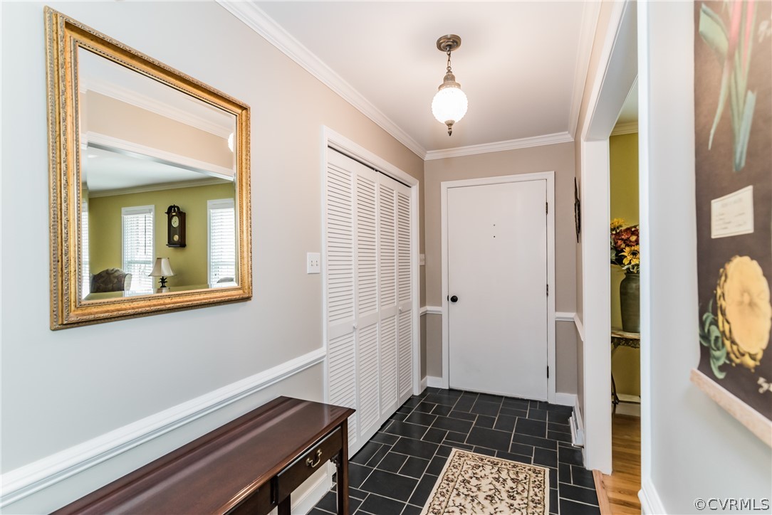 4401 Dunraven Road Chesterfield, VA 23236 - Photo 21 of 35 a view of a hallway with wooden floor and a livingroom