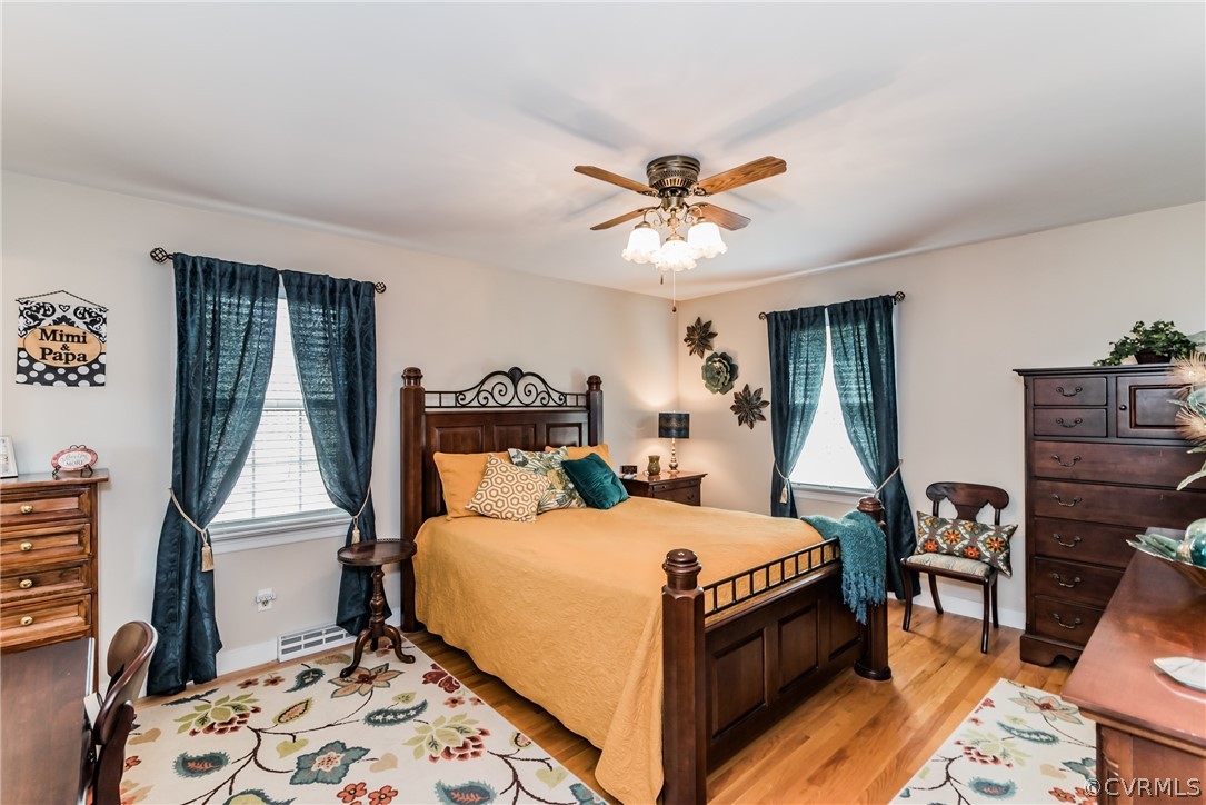 4401 Dunraven Road Chesterfield, VA 23236 - Photo 25 of 35 a bedroom with a bed and a chandelier