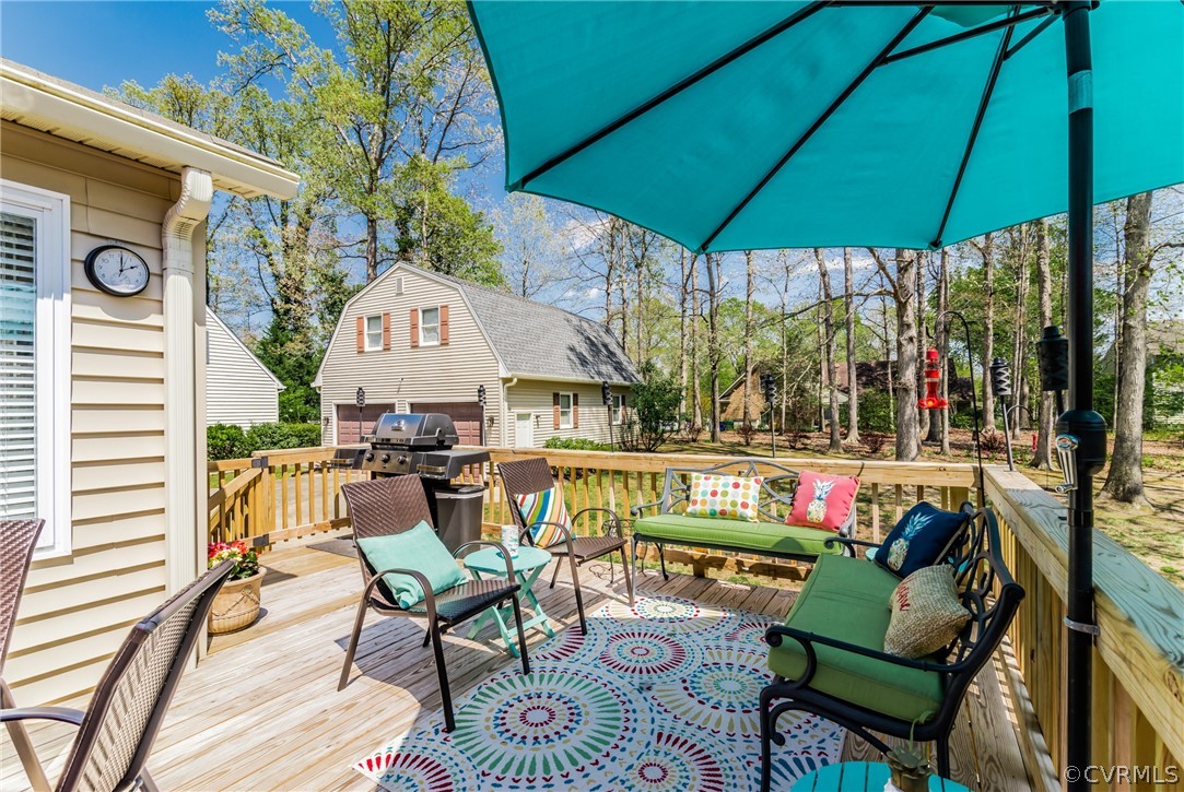 4401 Dunraven Road Chesterfield, VA 23236 - Photo 28 of 35 a view of a chairs and table in patio with a fire pit