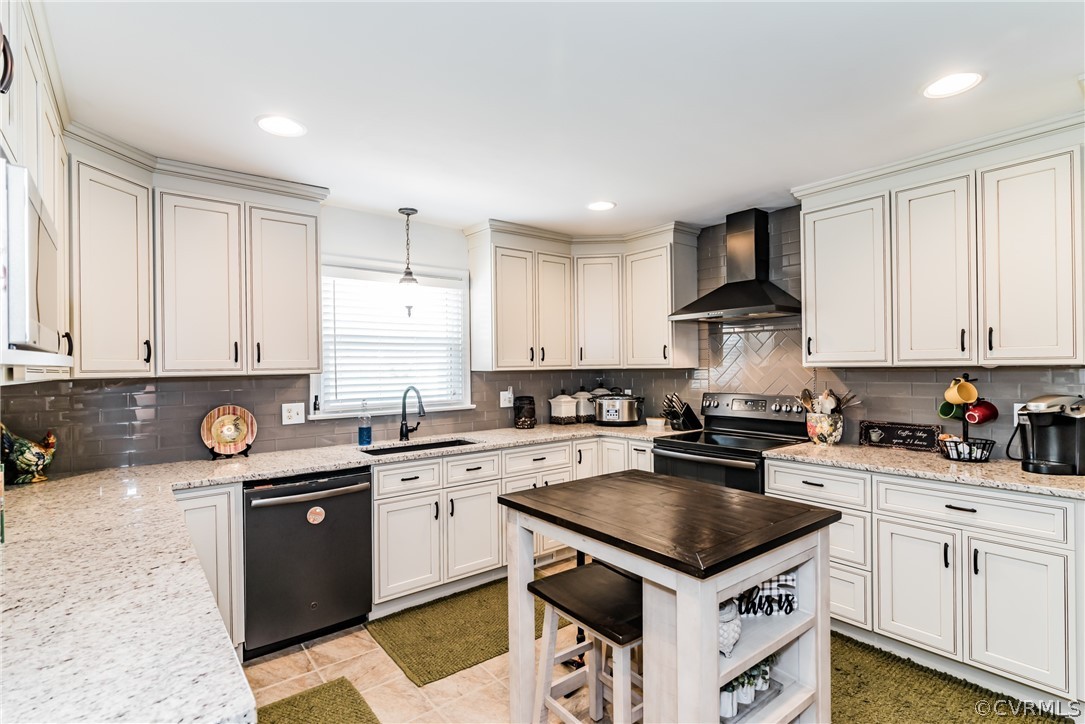 4401 Dunraven Road Chesterfield, VA 23236 - Photo 3 of 35 a kitchen with a stove sink and cabinets