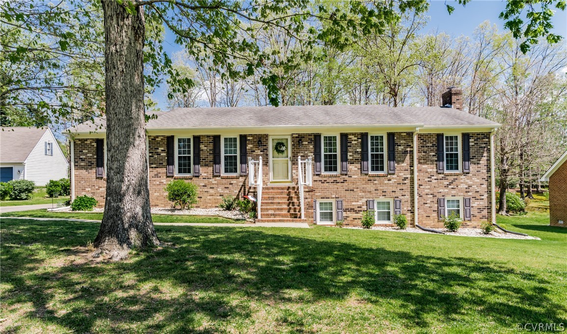 4401 Dunraven Road Chesterfield, VA 23236 - Photo 5 of 35 front view of a house with a yard