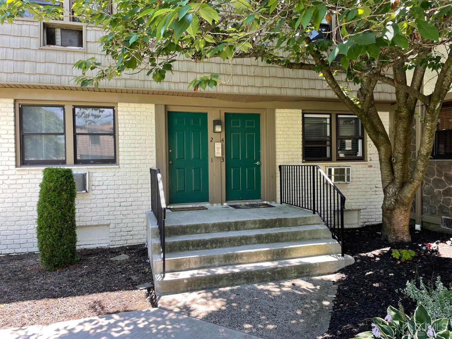 420 Cross Road, Unit B3 Matawan, NJ 07747 - Photo 2 of 24 a front view of a house with a garden