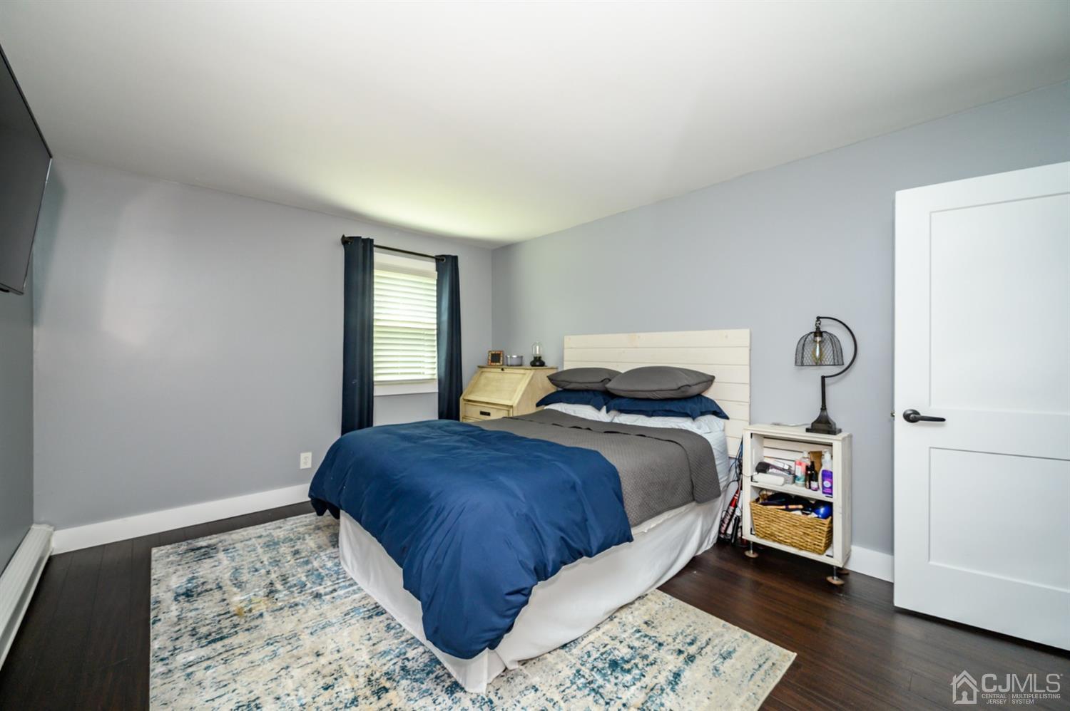420 Cross Road, Unit B3 Matawan, NJ 07747 - Photo 14 of 24 a bedroom with a bed and a window