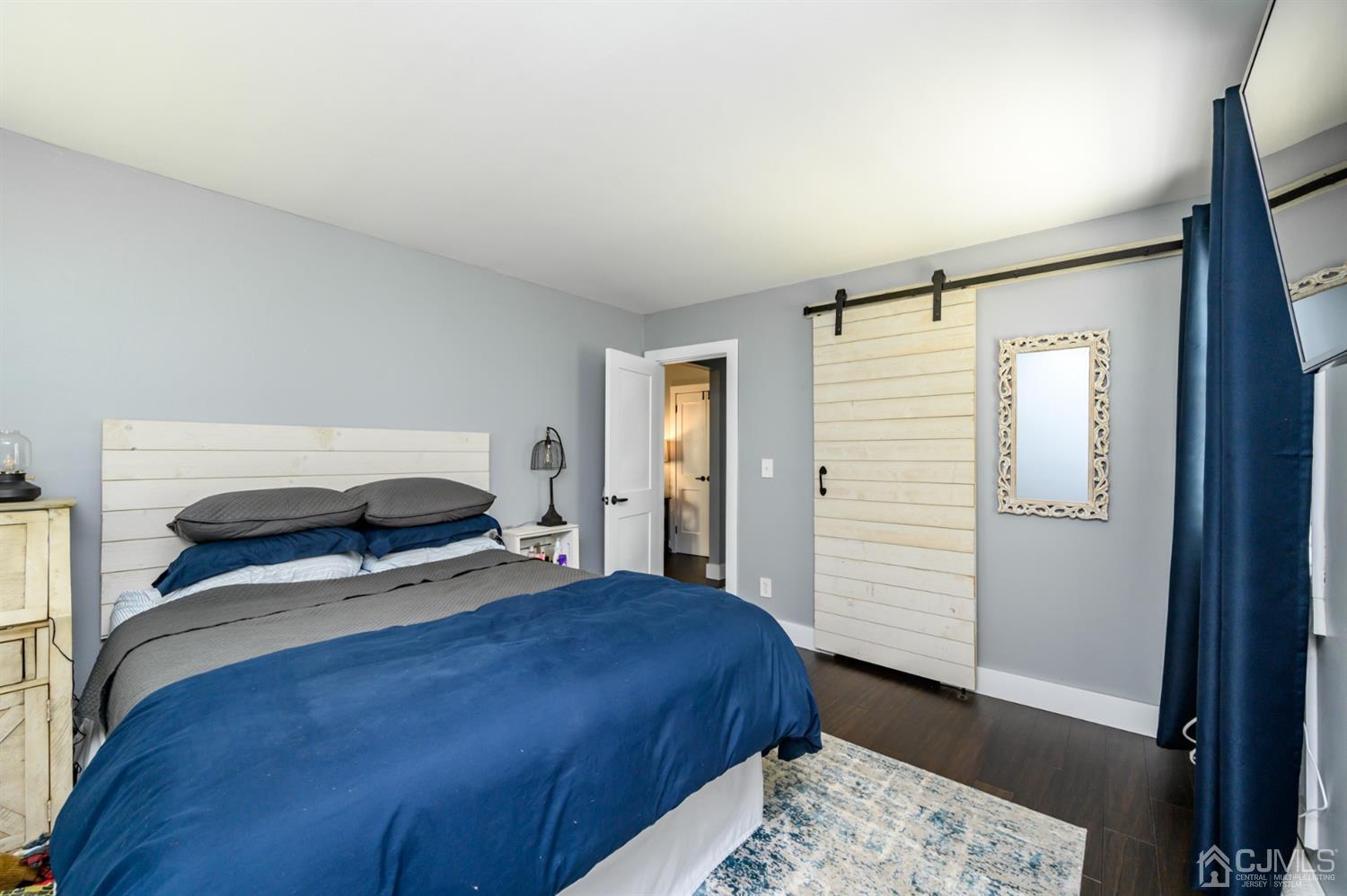 420 Cross Road, Unit B3 Matawan, NJ 07747 - Photo 16 of 24 a bedroom with a bed and a window