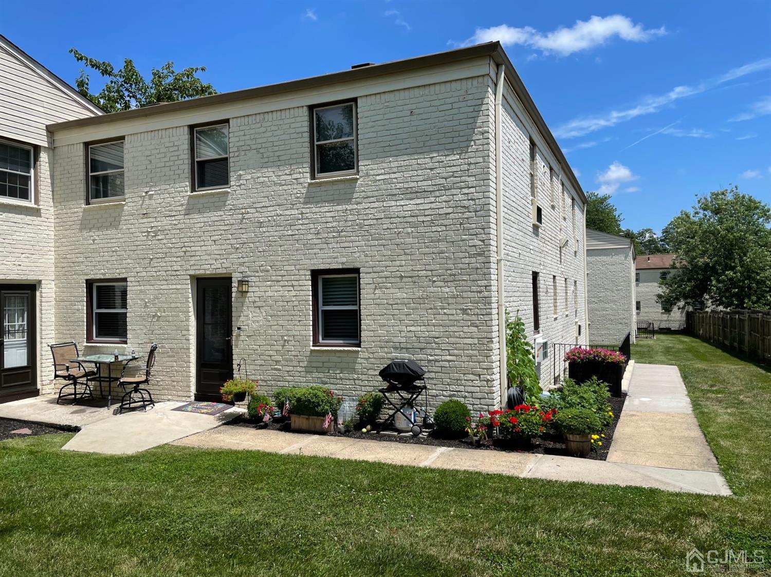420 Cross Road, Unit B3 Matawan, NJ 07747 - Photo 3 of 24 a front view of a house with a yard