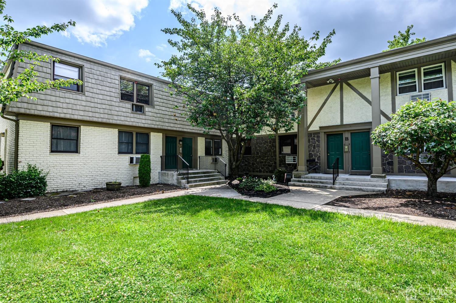 420 Cross Road, Unit B3 Matawan, NJ 07747 - Photo 24 of 24 a view of a house with a yard and sitting area