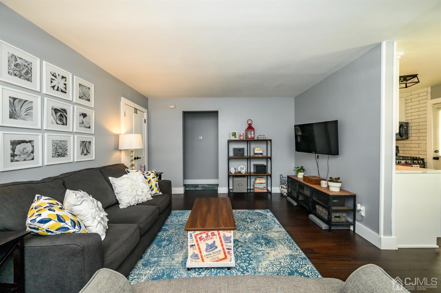 420 Cross Road, Unit B3 Matawan, NJ 07747 - Photo 4 of 24 a living room with furniture and a flat screen tv
