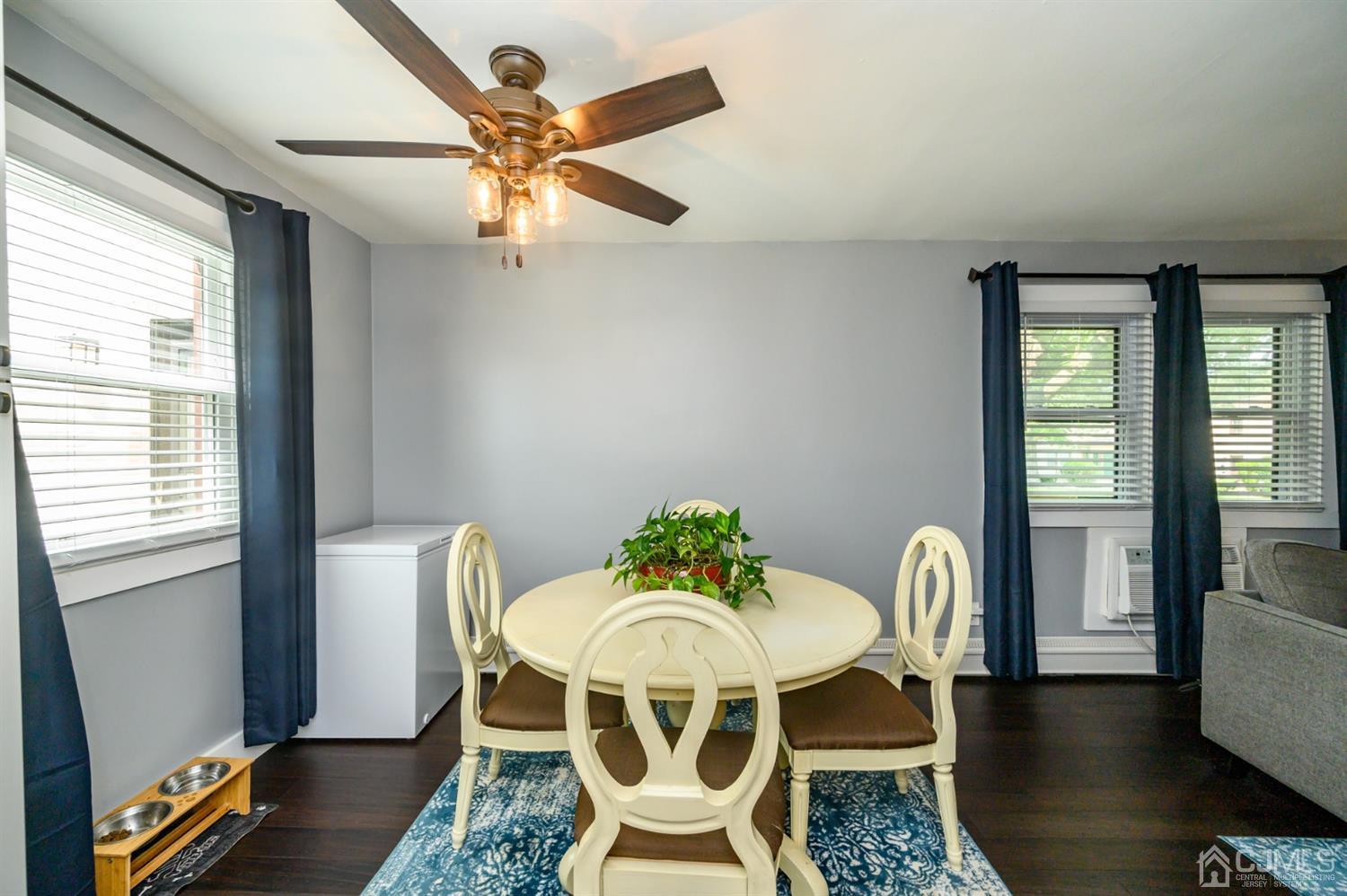 420 Cross Road, Unit B3 Matawan, NJ 07747 - Photo 10 of 24 a view of a dining room with furniture window and wooden floor