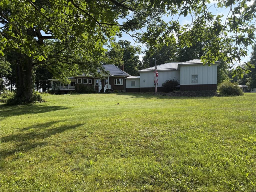644 Freeport Road Butler, PA 16002 - Photo 12 of 50 a front view of a house with a yard and trees