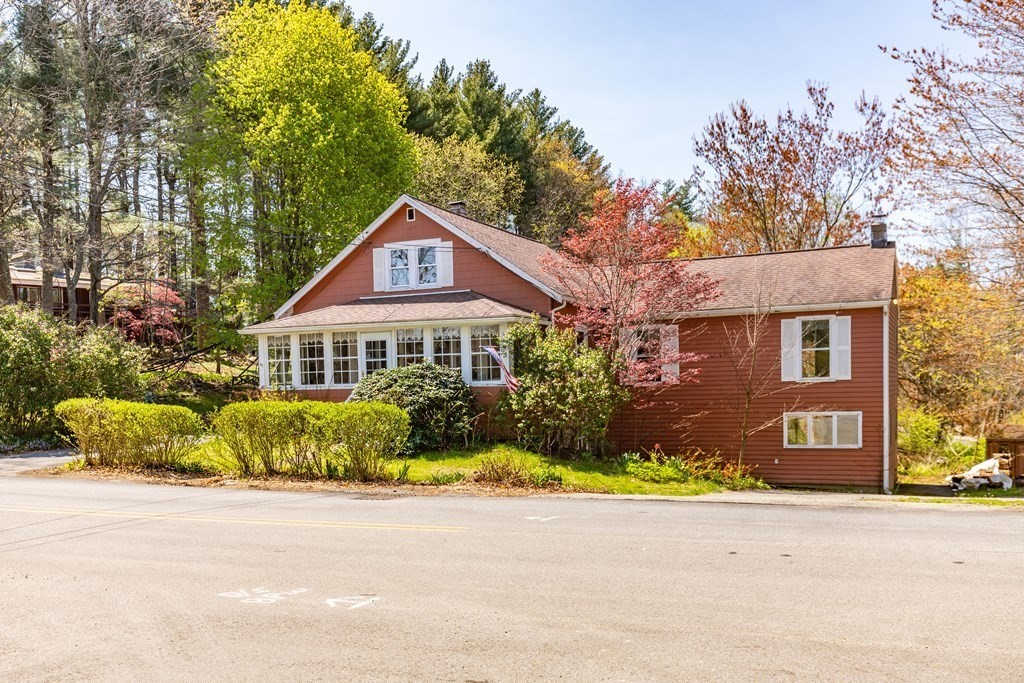 a front view of a house with a yard and a garage