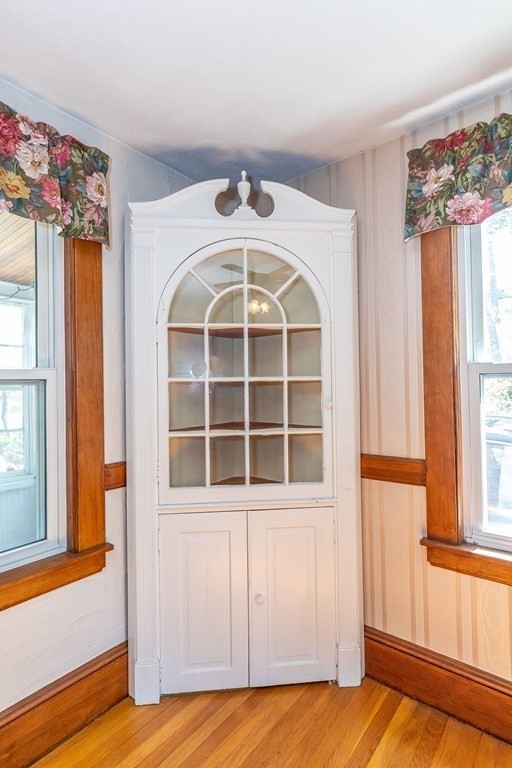 600 Springs Road Bedford, MA 01730 - Photo 15 of 38 a view of a bedroom with wooden floor and windows