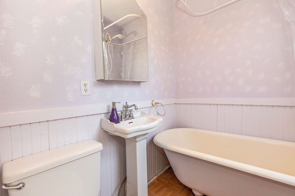 600 Springs Road Bedford, MA 01730 - Photo 22 of 38 a bathroom with a sink a toilet and bathtub