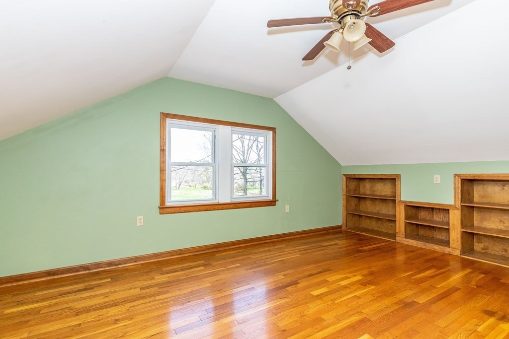 600 Springs Road Bedford, MA 01730 - Photo 23 of 38 an empty room with closet and fan