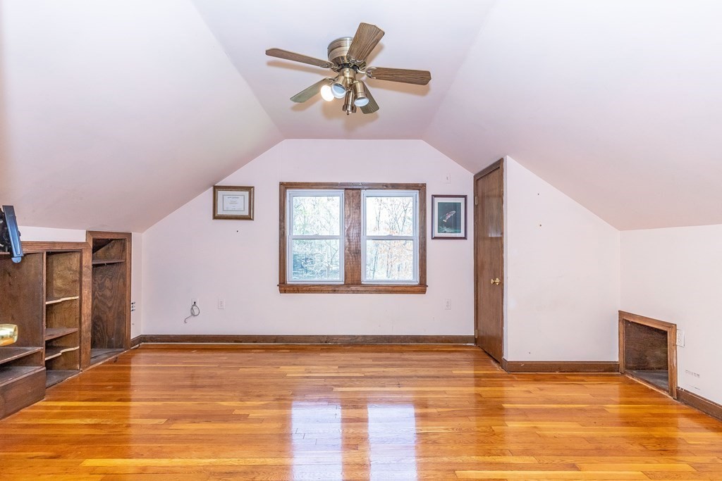 600 Springs Road Bedford, MA 01730 - Photo 26 of 38 a view of a kitchen with wooden floor and a ceiling fan
