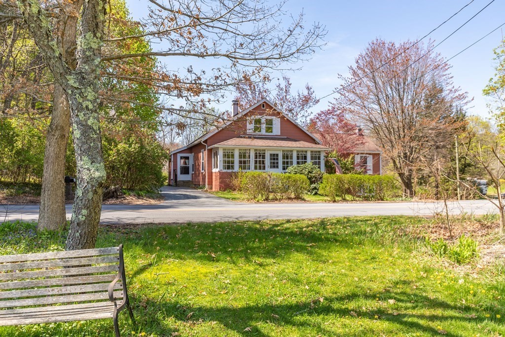 600 Springs Road Bedford, MA 01730 - Photo 3 of 38 a front view of house with yard and green space