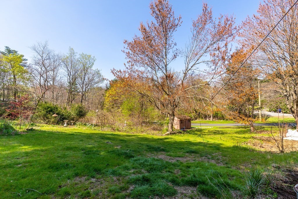 600 Springs Road Bedford, MA 01730 - Photo 7 of 38 a swimming pool with an outdoor space and seating area