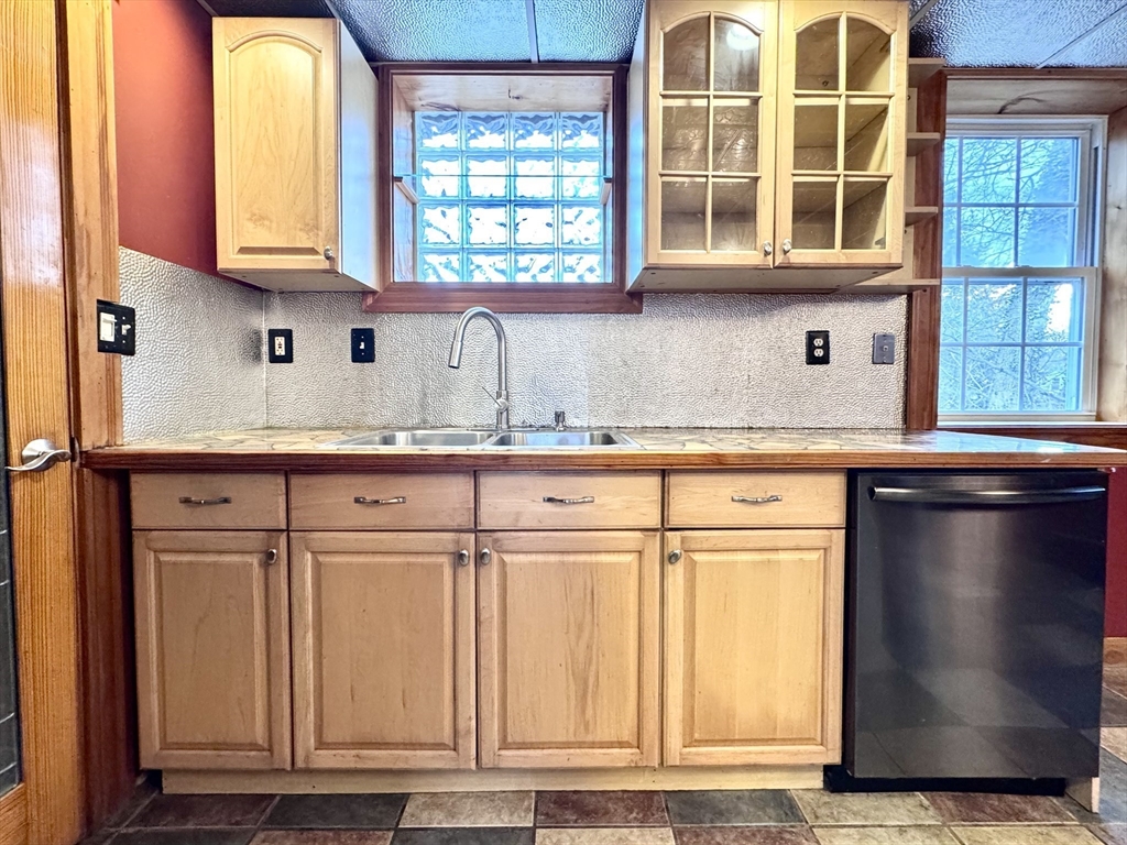 53 Circuit Road Dedham, MA 02026 - Photo 18 of 26 a kitchen with stainless steel appliances granite countertop a sink and a window