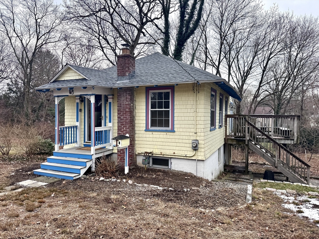 53 Circuit Road Dedham, MA 02026 - Photo 2 of 26 a view of house with a yard and the trees