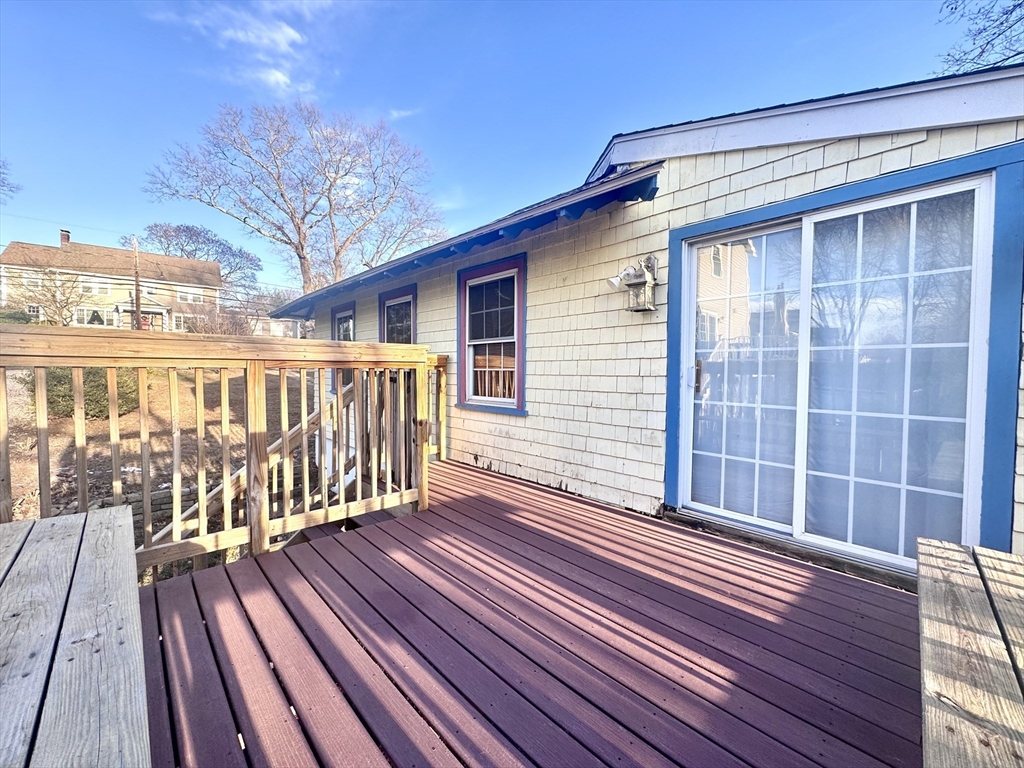 53 Circuit Road Dedham, MA 02026 - Photo 24 of 26 a view of a house with wooden deck