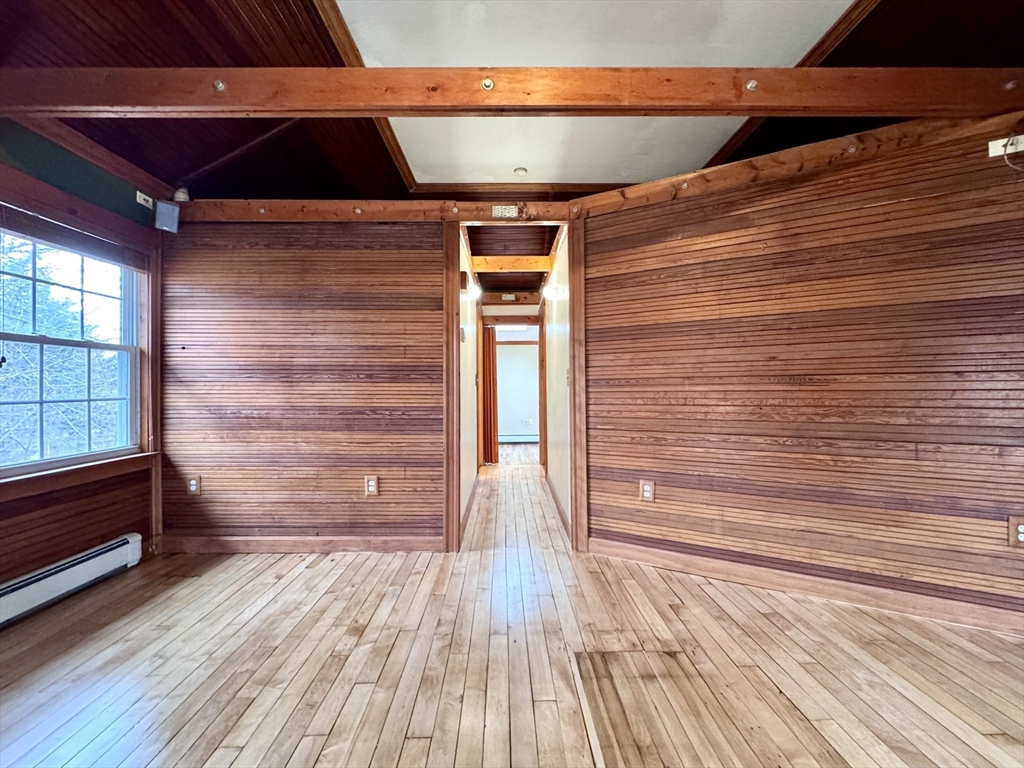 53 Circuit Road Dedham, MA 02026 - Photo 6 of 26 a view of empty room with wooden floor