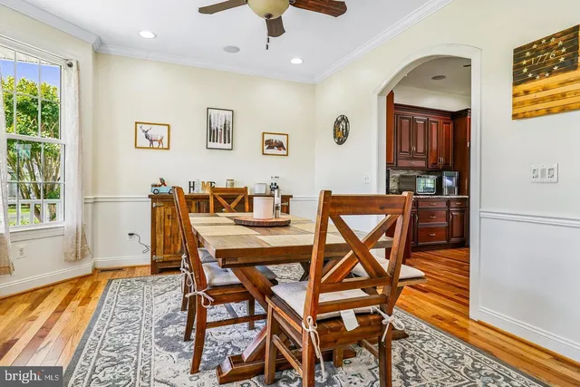 a dining room with furniture and window