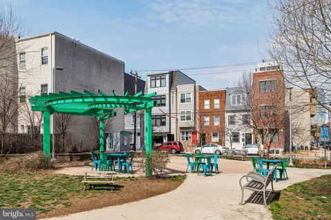 a view of parked cars park in front of a building