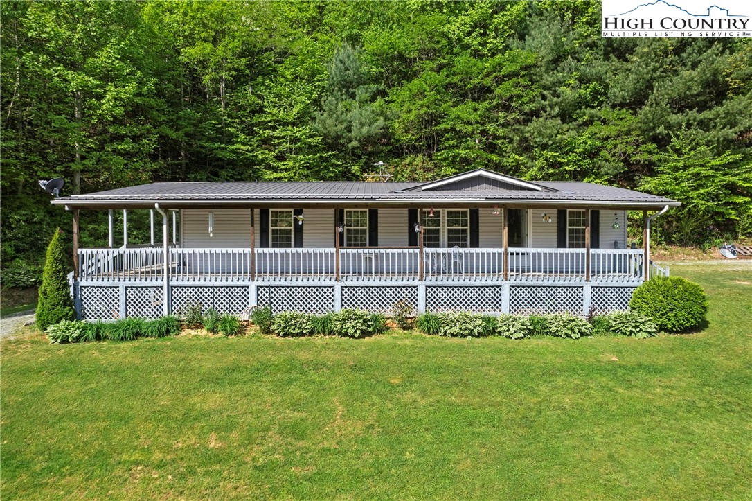 787 Lawrence Greene Road Deep Gap, NC 28618 - Photo 2 of 45 a front view of a house with a yard