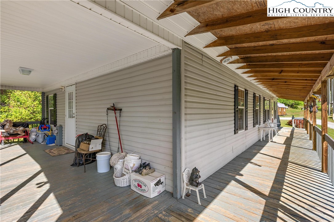 787 Lawrence Greene Road Deep Gap, NC 28618 - Photo 28 of 45 a view of a patio with wooden floor