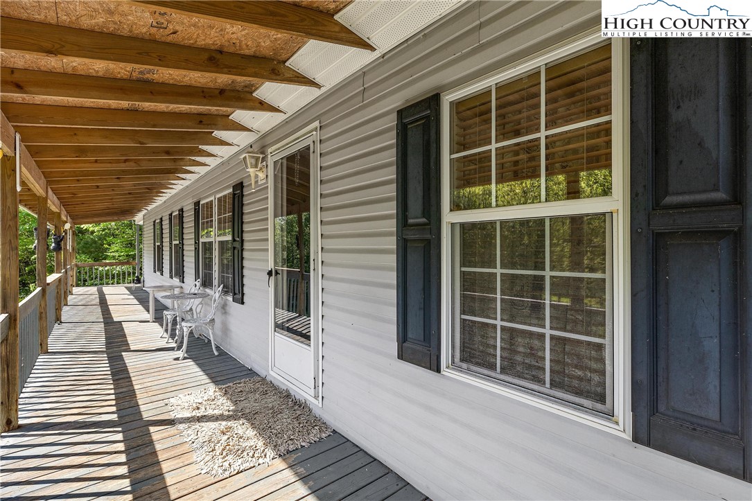 787 Lawrence Greene Road Deep Gap, NC 28618 - Photo 31 of 45 a view of a balcony with a large window