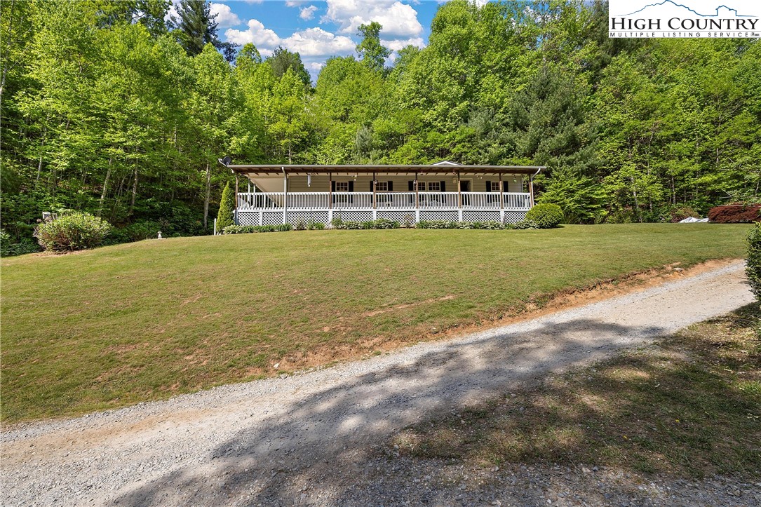 787 Lawrence Greene Road Deep Gap, NC 28618 - Photo 33 of 45 a front view of a house with a yard
