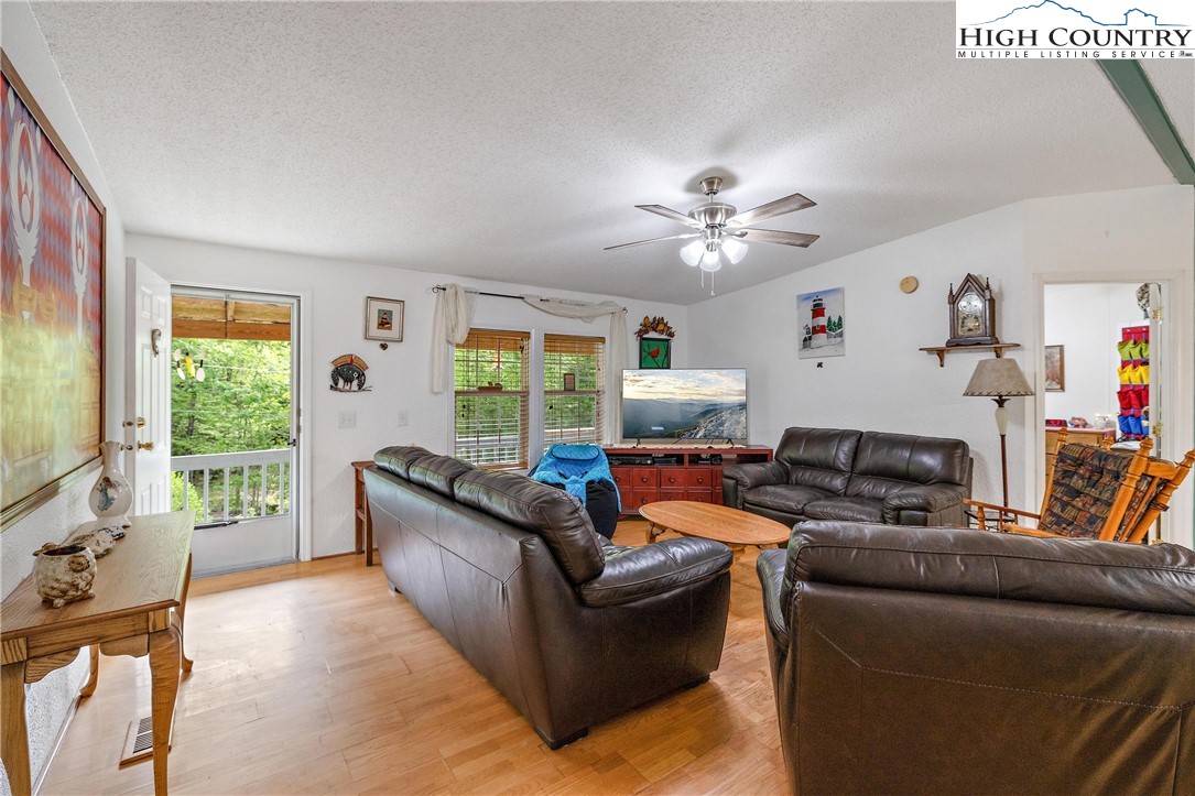 787 Lawrence Greene Road Deep Gap, NC 28618 - Photo 5 of 45 a living room with furniture and a large window