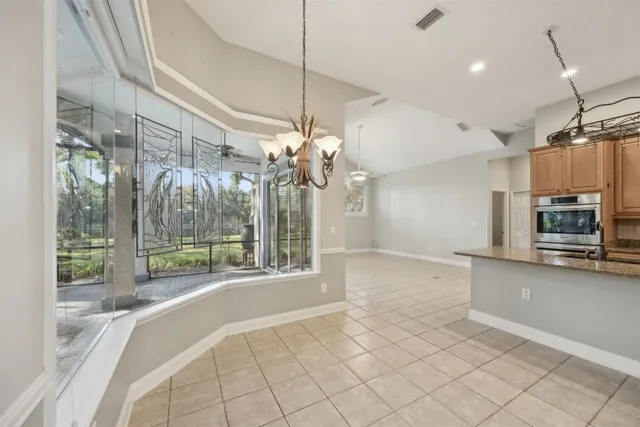 a view of a kitchen with furniture and chandelier