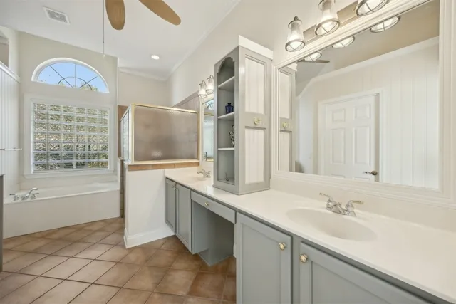 a bathroom with a sink a large mirror and a bathtub