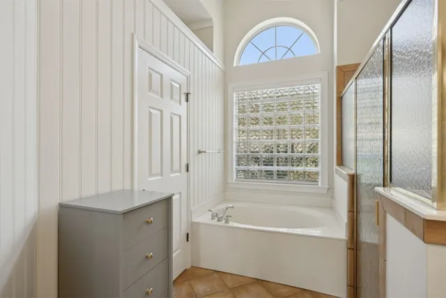 a bathroom with a tub and a sink