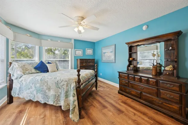 a bed room with a bed and a mirror