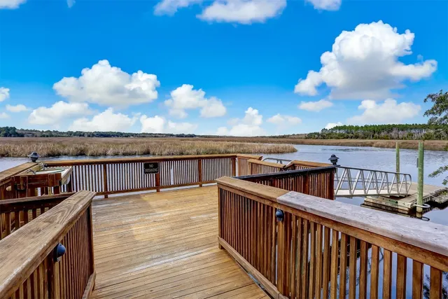 a view of a balcony with wooden floor