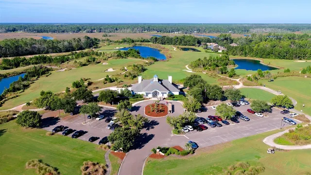 an aerial view of lake residential house with swimming pool and outdoor space