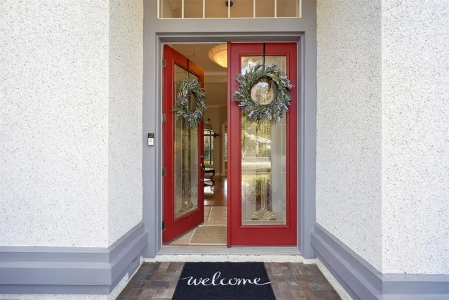 a view of a entryway door front of red house