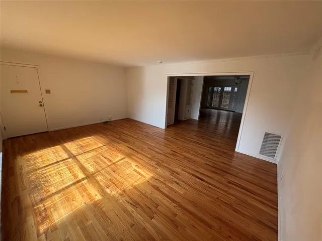 a view of wooden floor in an empty room