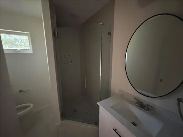 a bathroom with a sink and toilet